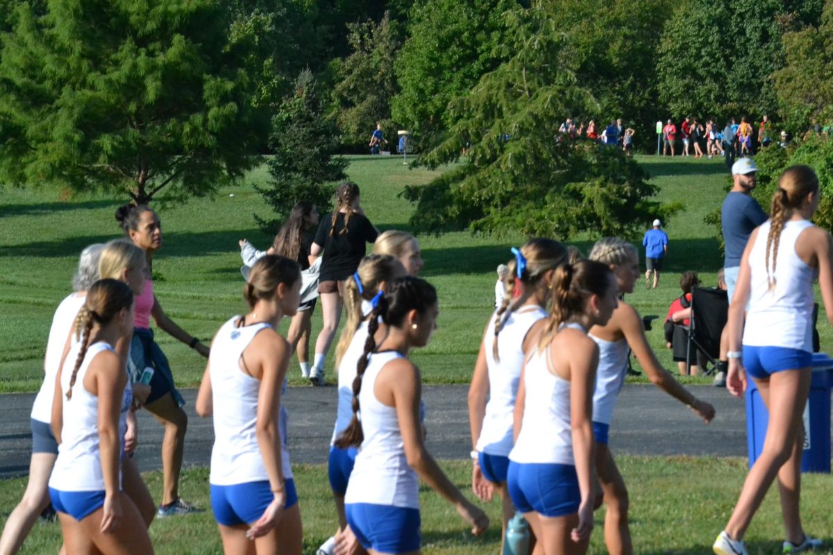 Girls Cross Country walks to the start line at John Cleland Invitational on August 24.