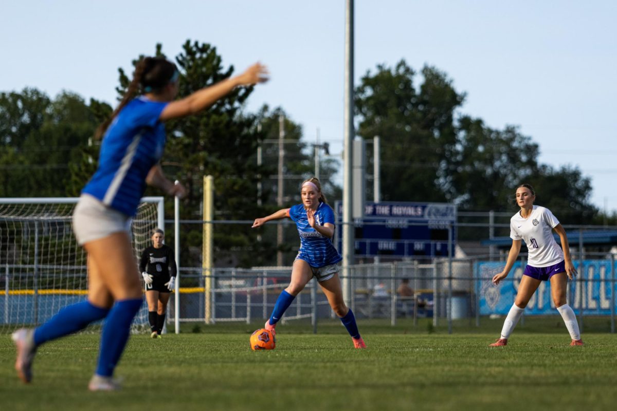 Player of the game, Senior Cole Lance, dominates the midfield and looks up to find senior Gracie Pyle open on the wing.