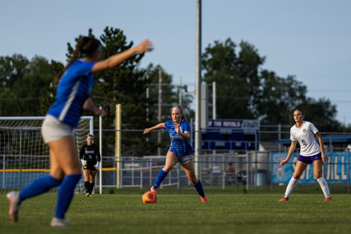 Senior Cole Lance controls the midfield and looks up to find senior Gracie Pyle open on the wing.