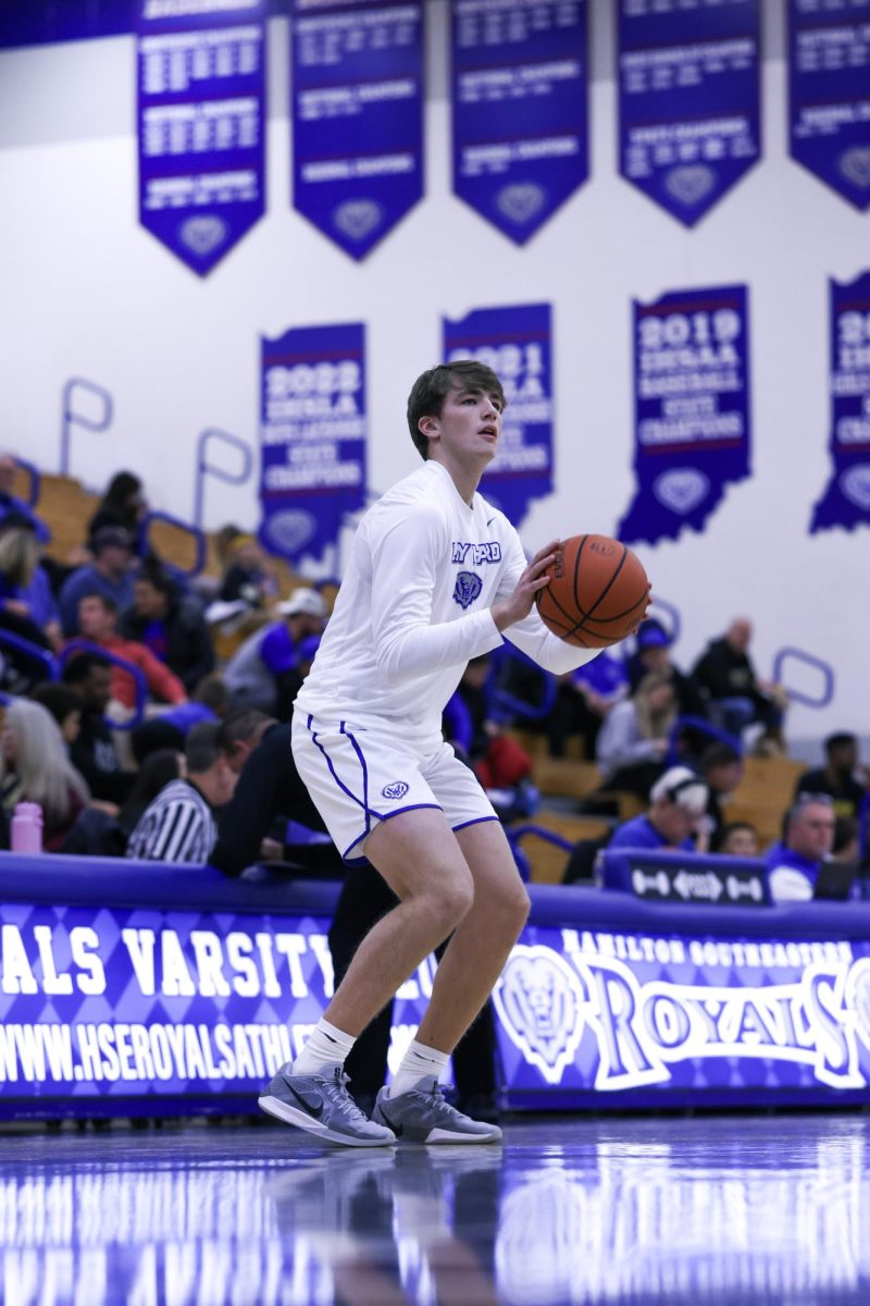 Senior Braeden Totton warms up to play against the Brebeuf Jesuit Braves on December 13th, 2024.