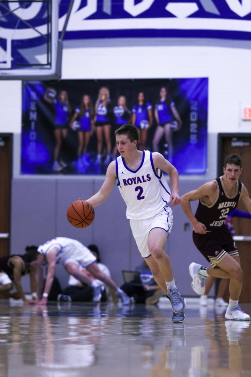 Jack Jacobs dribbles up the court against the Brebeuf Jesuit Braves on December 13th, 2024.