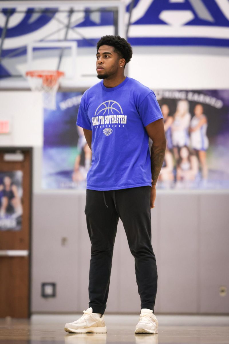 Coach Noah Smith coaching at a HSE Boys Basketball practice. 