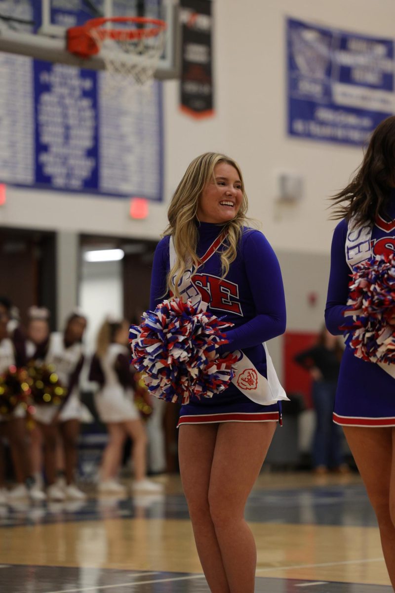 Girls Cheerleading Supporting Boys Basketball against Brebeuf on Dec. 13.