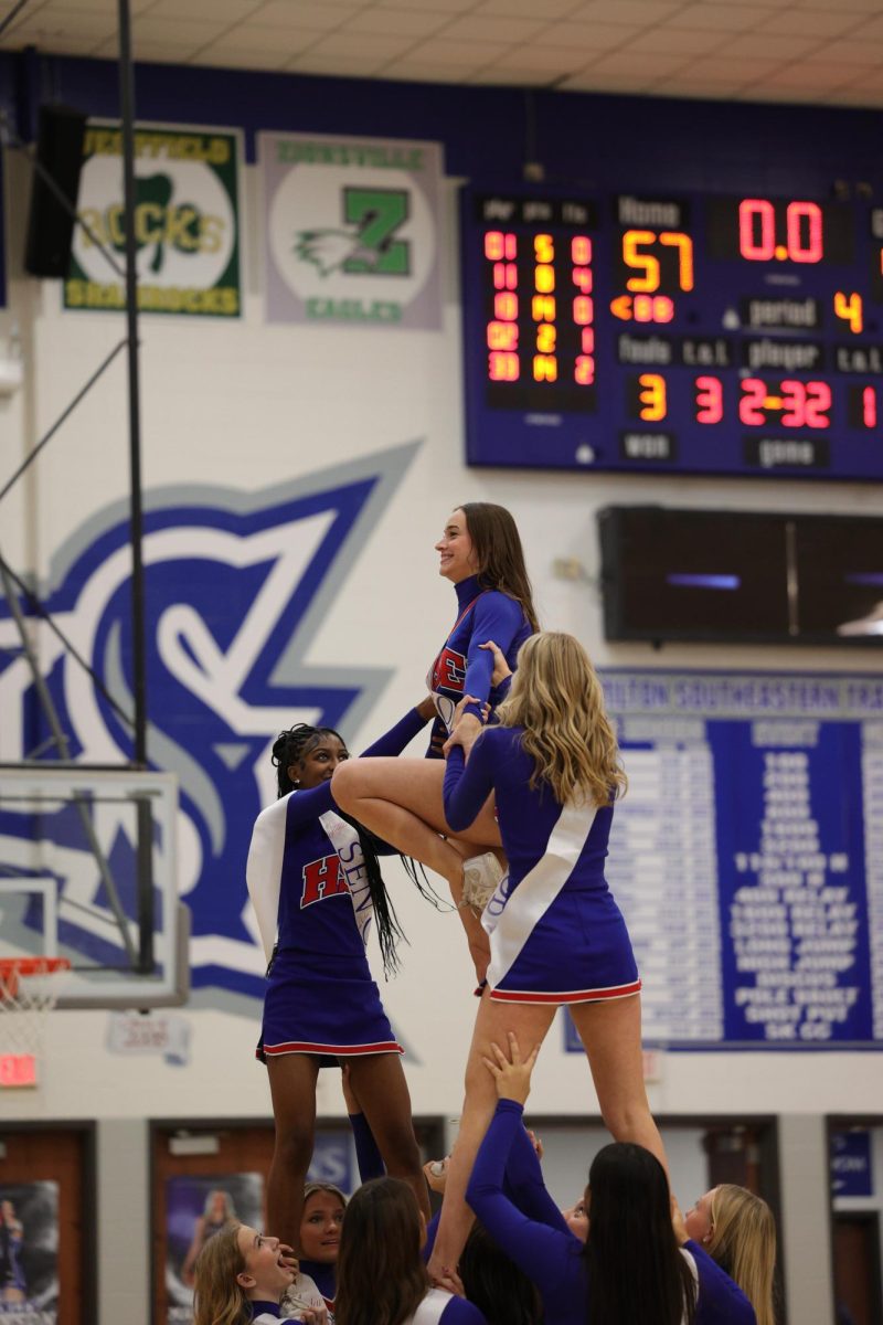 Girls Cheerleading Supporting Boys Basketball against Brebeuf on Dec. 13.