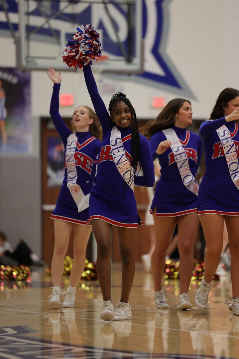 Girls Cheerleading Supporting Boys Basketball against Brebeuf on Dec. 13.