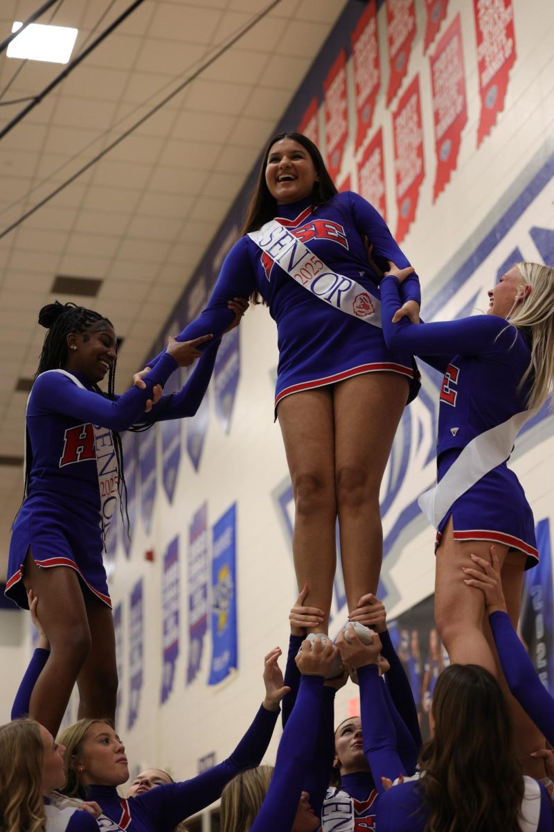 Girls Cheerleading Supporting Boys Basketball against Brebeuf on Dec. 13.