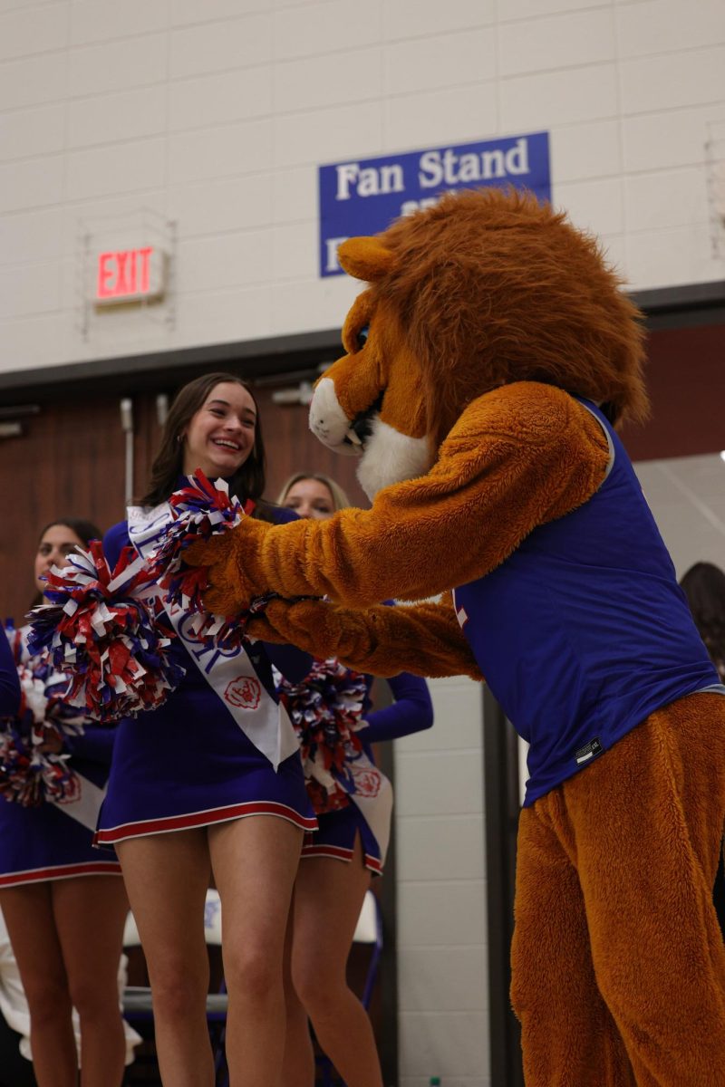 Girls Cheerleading Supporting Boys Basketball against Brebeuf on Dec. 13.