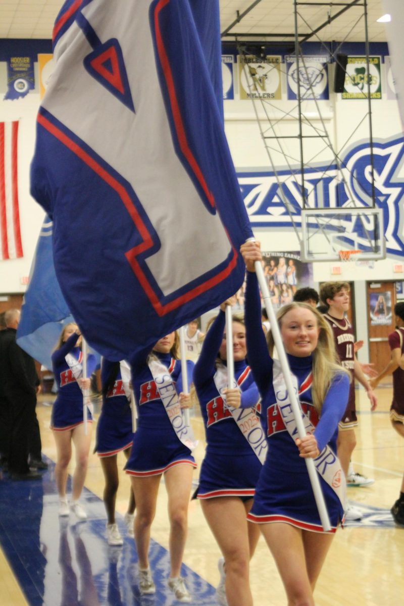 Girls Cheerleading Supporting Boys Basketball against Brebeuf on Dec. 13.