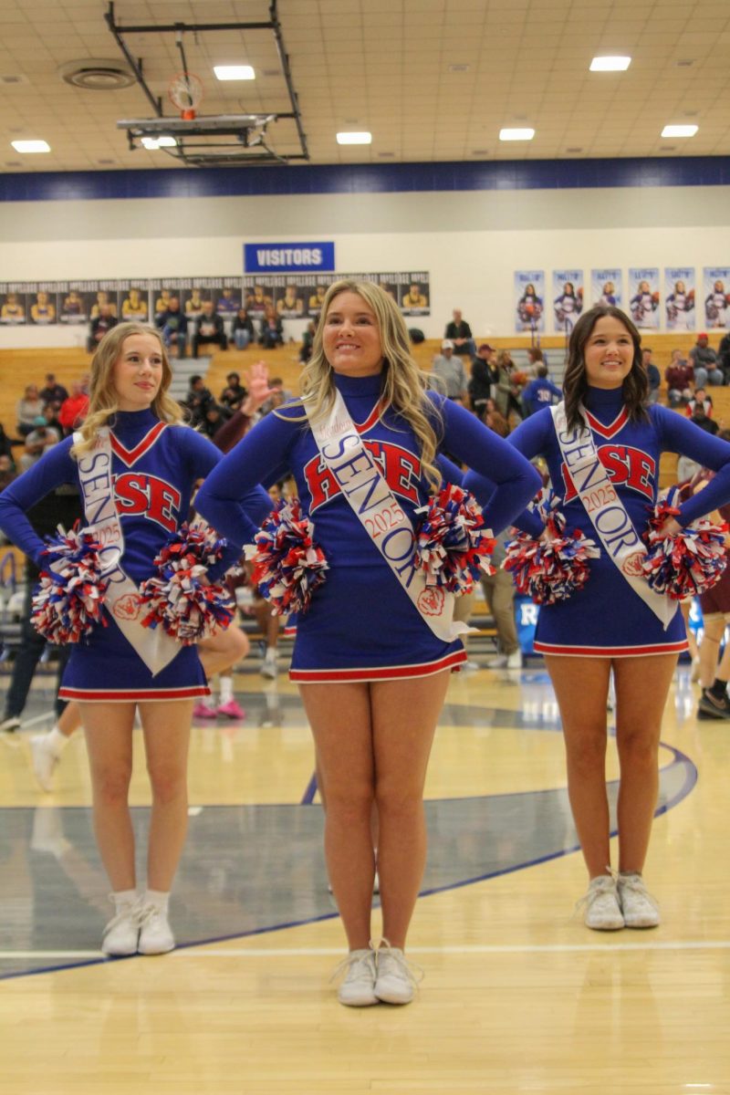 Girls Cheerleading Supporting Boys Basketball against Brebeuf on Dec. 13.