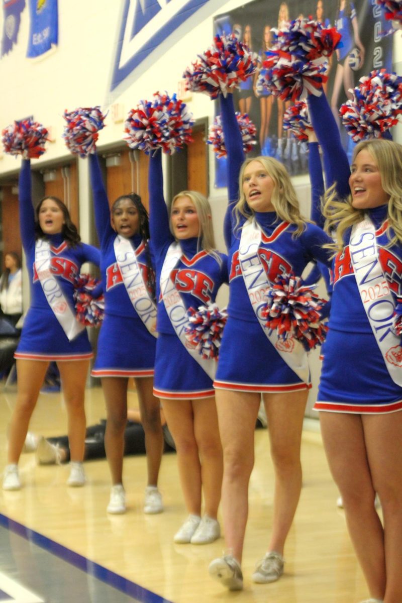 Girls Cheerleading Supporting Boys Basketball against Brebeuf on Dec. 13.