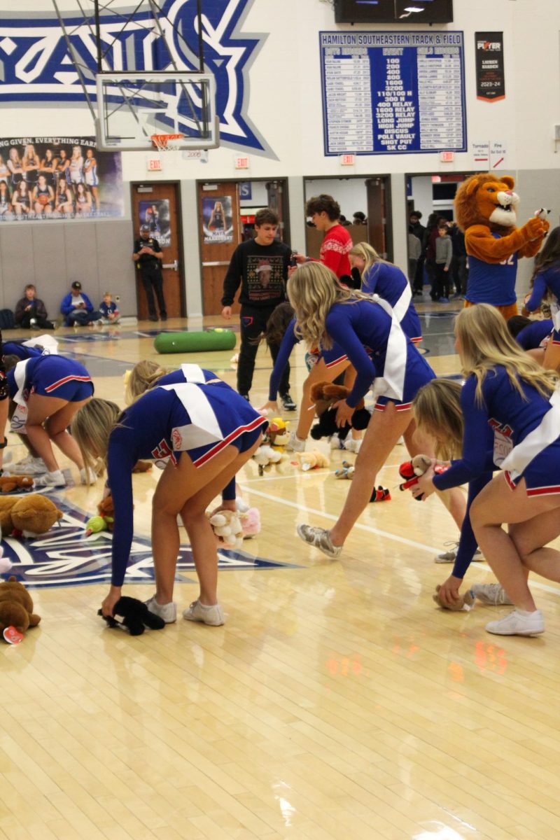 Girls Cheerleading Supporting Boys Basketball against Brebeuf on Dec. 13.