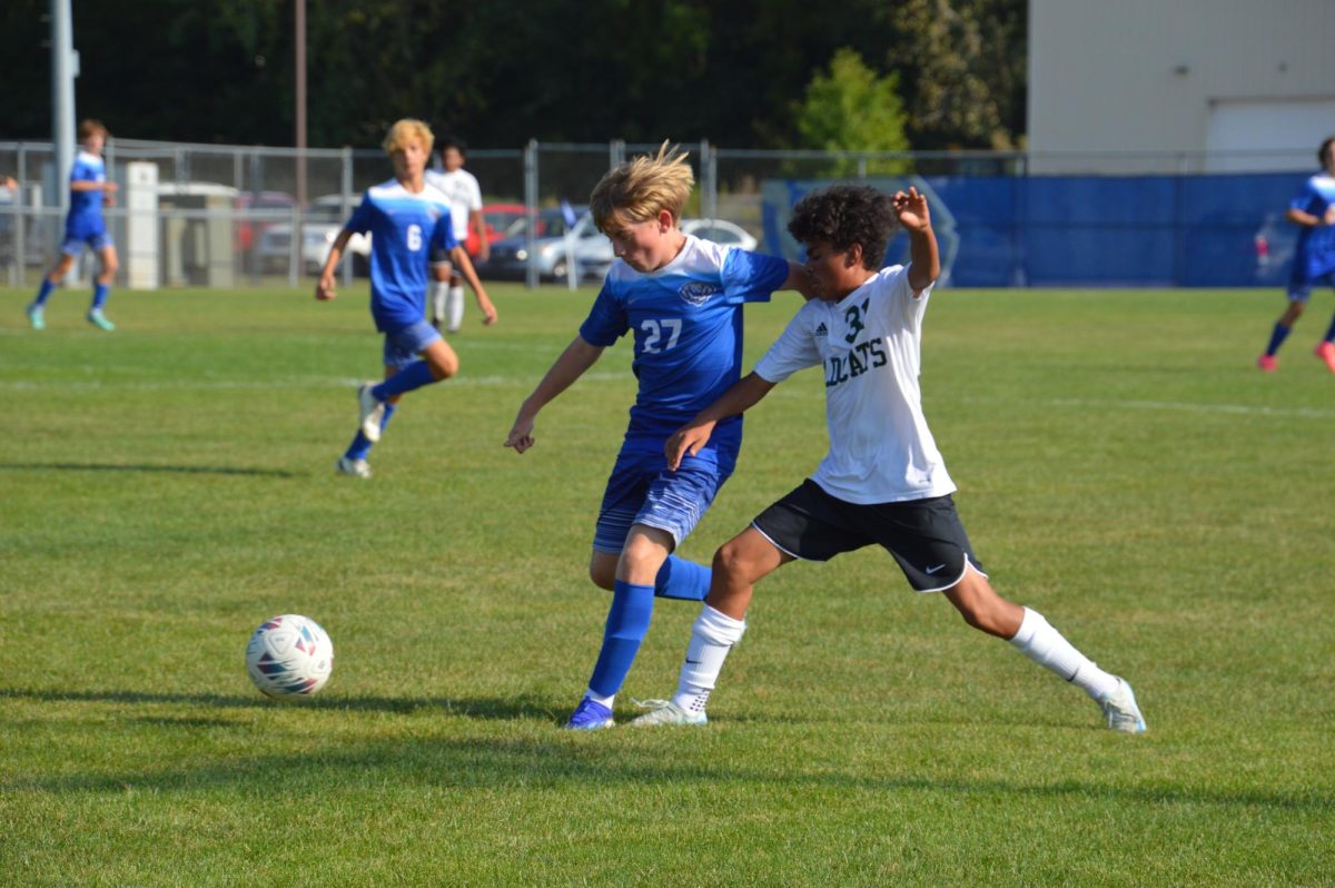 READY FOR IT: Laser-focused on the soccer ball, freshman Clifford Hackney charges ahead, leaving his opponent in the dust. 