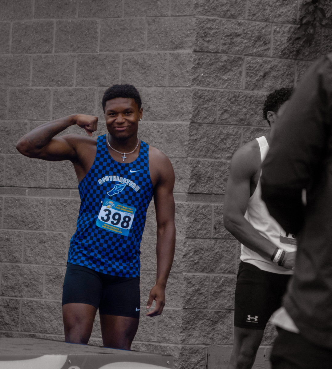 Mason Alexander finds the camera and poses during the 2024 IHSAA Boys Track and Field State Championships on June 1, 2024 wearing number 398. He finished 5th in the Boys 100-Meter Dash Final and first alongside his team in the Boys 4x100-Meter Relay.