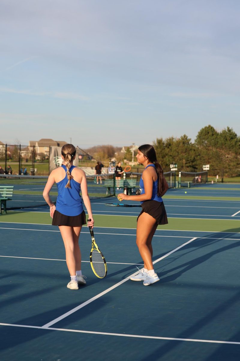 Ella Tappendorf and Naina Patwardhan prepare for their match against Zionsville on April 15, 2025.