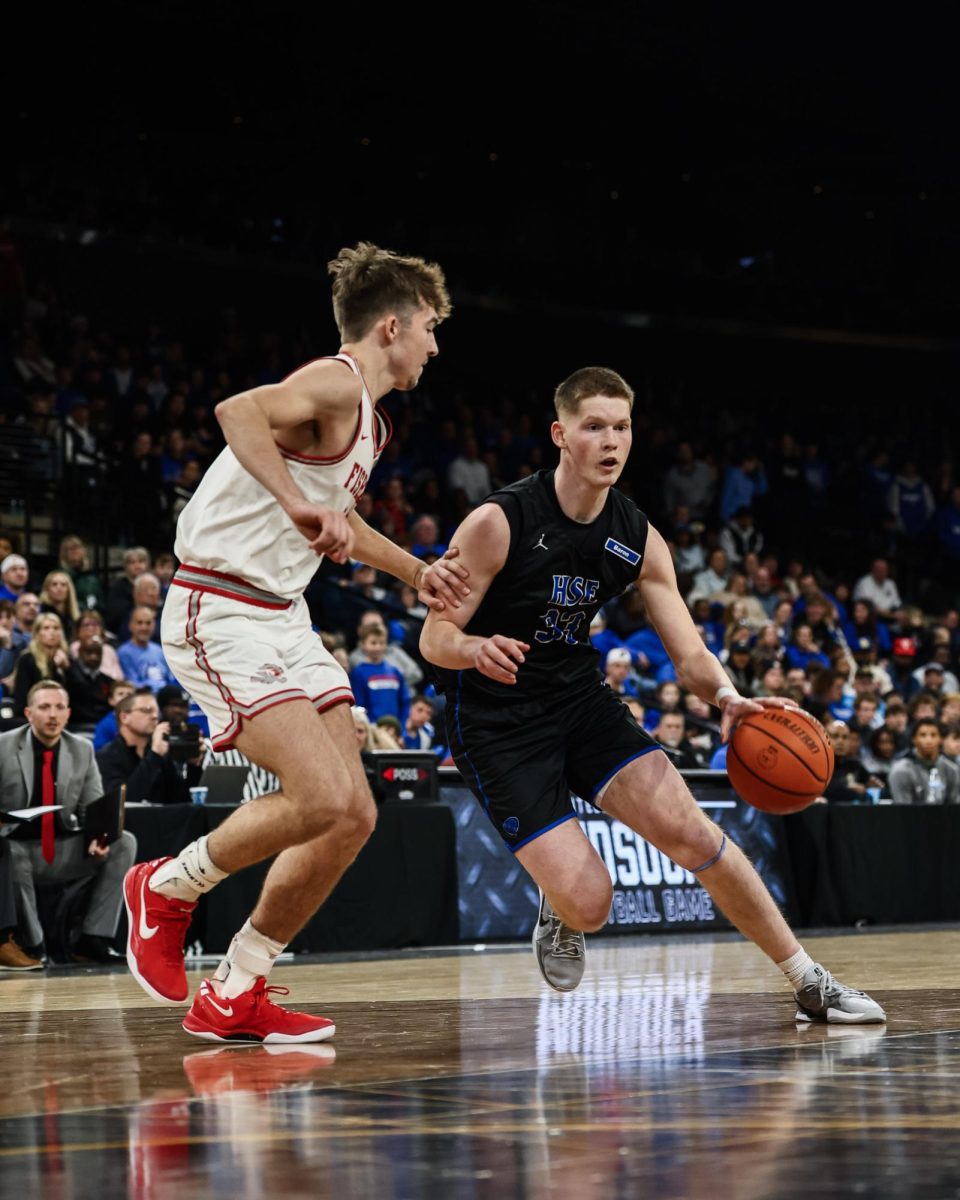 Junior Luke Weemer drives to the basket in the annual Mudsock Game vs. Fishers at the Fishers Event Center on December 20th, 2024