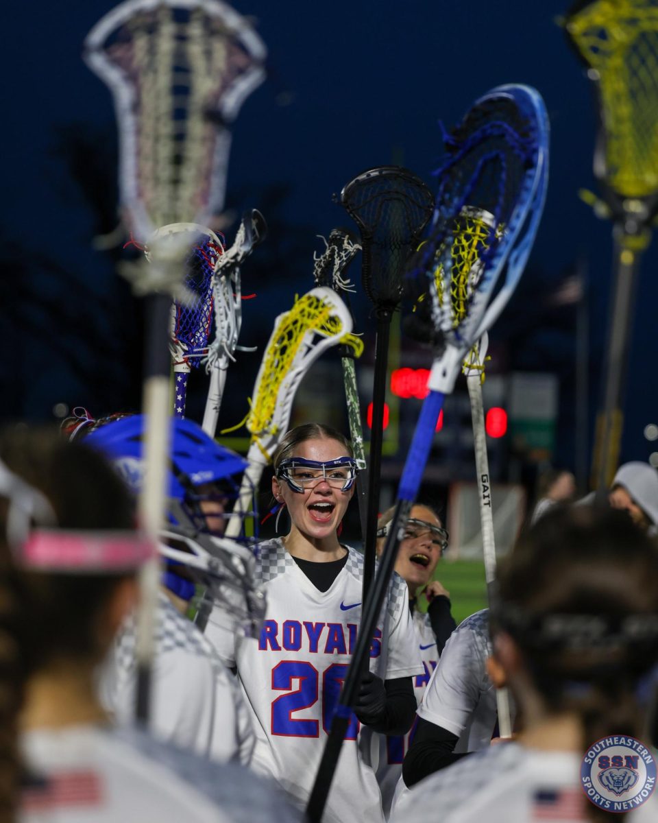 Girls Lacrosse cheers together during their game against Center Grove High School at Hamilton Southeastern High School on Mar. 12, 2026.