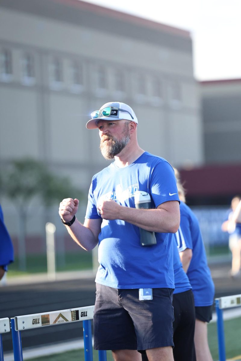 Coach Moosbrugger cheering on the Unified Track athletes